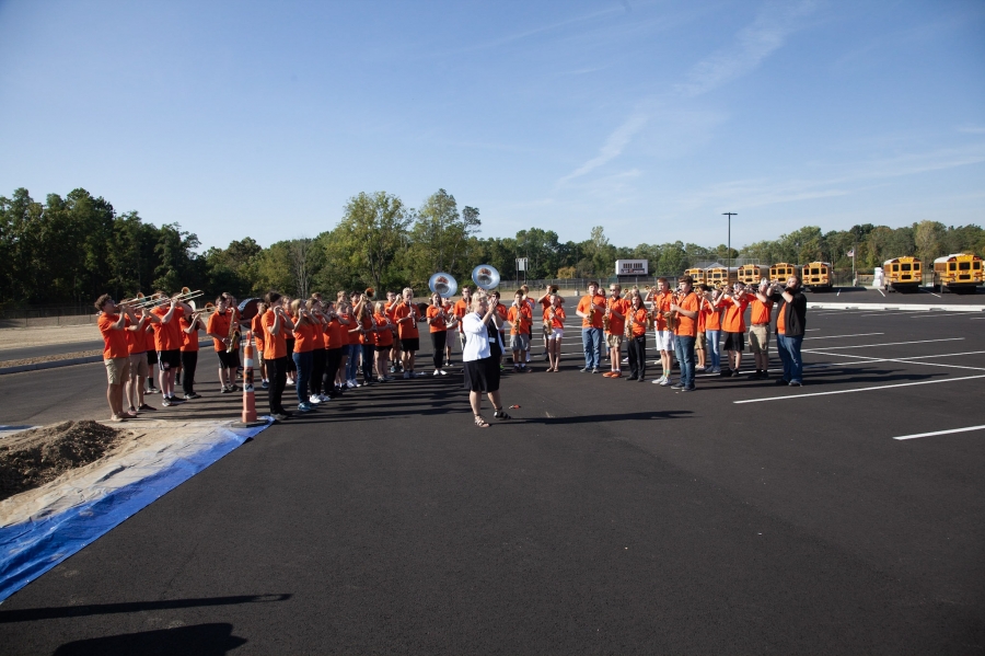 band wearing orange shirts